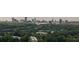 Scenic cityscape skyline in background, complemented by lush greenery in foreground at 9 Saint Claire Ne Ln, Atlanta, GA 30324