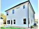 The back exterior of this two-story home features white vinyl siding, black trim and various windows at 12 Confederate Nw St, Cartersville, GA 30121