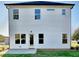 Exterior of a house featuring white siding, dark trim and a concrete patio at 12 Confederate Nw St, Cartersville, GA 30121