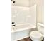 Clean bathroom featuring a bathtub, toilet, and vinyl wood look flooring at 12 Confederate Nw St, Cartersville, GA 30121