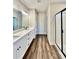 Spacious bathroom with dual vanity, quartz counters, wood-look floors and a sleek glass-enclosed shower at 12 Confederate Nw St, Cartersville, GA 30121