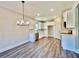Bright kitchen featuring white cabinets, granite countertops, and stainless steel appliances at 12 Confederate Nw St, Cartersville, GA 30121