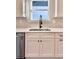 Modern kitchen sink with matte black faucet and stainless steel appliances, complemented by a bright window at 12 Confederate Nw St, Cartersville, GA 30121