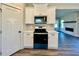 Well-equipped kitchen with black appliances and white countertops at 12 Confederate Nw St, Cartersville, GA 30121