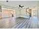 Open-concept living space with hardwood floors connecting the living room, dining area, and kitchen at 12 Confederate Nw St, Cartersville, GA 30121