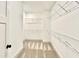 Spacious walk-in closet with white wire shelving and carpeted floor at 12 Confederate Nw St, Cartersville, GA 30121