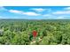 Aerial view of property surrounded by mature trees with marker indicating location at 1406 Arden Sw Dr, Marietta, GA 30008