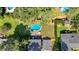 Aerial view of backyard featuring a pool, deck, mature trees, and well-manicured lawn at 1406 Arden Sw Dr, Marietta, GA 30008