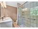 Updated bathroom features a glass door shower and modern vanity with double sinks at 1406 Arden Sw Dr, Marietta, GA 30008