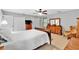 Traditional bedroom with neutral colors, a ceiling fan, and a coordinating wooden dresser at 1406 Arden Sw Dr, Marietta, GA 30008