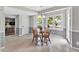 Bright breakfast nook with tile flooring, a chandelier, and windows overlooking the outdoor pool area at 1406 Arden Sw Dr, Marietta, GA 30008
