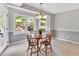 Charming dining room with a round table, four chairs, and backyard view at 1406 Arden Sw Dr, Marietta, GA 30008