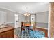 Charming dining room featuring hardwood floors, elegant decor, and access to the kitchen at 1406 Arden Sw Dr, Marietta, GA 30008