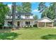 Charming two-story home with a well-manicured lawn and convenient covered parking at 1406 Arden Sw Dr, Marietta, GA 30008