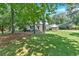 Traditional two-story home with lush green lawn and convenient covered parking space at 1406 Arden Sw Dr, Marietta, GA 30008