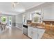 Well-lit kitchen showcasing granite counters, stainless dishwasher and bright interior at 1406 Arden Sw Dr, Marietta, GA 30008