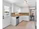 Functional kitchen featuring white cabinets, stainless steel dishwasher, and granite countertops at 1406 Arden Sw Dr, Marietta, GA 30008