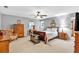 Expansive main bedroom features carpet, a ceiling fan, neutral colors, and large windows at 1406 Arden Sw Dr, Marietta, GA 30008