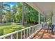 Charming covered porch offering a relaxing view of the beautiful landscaped yard at 1406 Arden Sw Dr, Marietta, GA 30008