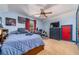 Bright bedroom with comfortable bed, ceiling fan and a large window at 2015 Buford Dam Rd, Buford, GA 30518