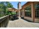 Outdoor deck with dining furniture and a patio umbrella at 2015 Buford Dam Rd, Buford, GA 30518
