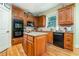 Well-equipped kitchen with custom cabinets, granite countertops, and stainless steel appliances at 2015 Buford Dam Rd, Buford, GA 30518