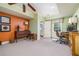 Carpeted home office/bedroom with neutral paint, natural lighting, and light trim at 2015 Buford Dam Rd, Buford, GA 30518