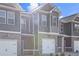 Townhome exterior featuring brick accents and modern siding design at 253 Ivey Ter, Temple, GA 30179
