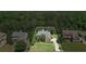 Aerial view of a well-maintained home with manicured landscaping, nestled in a serene, tree-filled neighborhood at 2660 Brentwood Estates Ct, Cumming, GA 30041