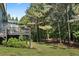 An expansive backyard featuring a deck perfect for outdoor dining and views of the mature trees at 2660 Brentwood Estates Ct, Cumming, GA 30041