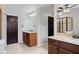 Dual vanities and private door to walk-in shower add convenience to the main bathroom at 2660 Brentwood Estates Ct, Cumming, GA 30041