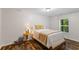 Cozy bedroom with wood-look floors and natural light at 2660 Brentwood Estates Ct, Cumming, GA 30041