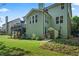 Exterior of home featuring a deck, shed, and a beautifully maintained lawn and mature landscaping at 2660 Brentwood Estates Ct, Cumming, GA 30041
