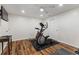 Gym featuring a ceiling fan and an exercise machines on the wooden floor at 2660 Brentwood Estates Ct, Cumming, GA 30041