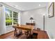 Bright home office with hardwood floors, a large window, and classic furnishings at 2660 Brentwood Estates Ct, Cumming, GA 30041