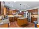Kitchen with hardwood floors, granite counters, and stainless appliances at 2660 Brentwood Estates Ct, Cumming, GA 30041