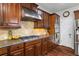 Close up of a kitchen featuring high end stainless steel appliances and granite counters at 2660 Brentwood Estates Ct, Cumming, GA 30041