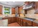 Gourmet kitchen featuring custom cabinets, granite countertops, and hardwood floors at 2660 Brentwood Estates Ct, Cumming, GA 30041