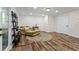 Spacious living room with recessed lights, hardwood floors, and a comfortable couch at 2660 Brentwood Estates Ct, Cumming, GA 30041