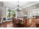 Bright and airy living room featuring large windows, hardwood floors, and elegant trim at 2660 Brentwood Estates Ct, Cumming, GA 30041
