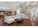 Hardwood floors, open concept, fireplace, and staircase in a welcoming living room at 2660 Brentwood Estates Ct, Cumming, GA 30041