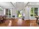 Bright and airy living room featuring large windows, hardwood floors, and elegant trim at 2660 Brentwood Estates Ct, Cumming, GA 30041