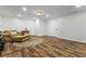 Spacious living room with recessed lights, hardwood floors, and a comfortable couch at 2660 Brentwood Estates Ct, Cumming, GA 30041