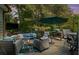 Outdoor patio with comfortable seating and an umbrella at 2660 Brentwood Estates Ct, Cumming, GA 30041
