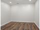 Flex space features wood-look flooring and neutral paint at 2660 Brentwood Estates Ct, Cumming, GA 30041