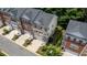 Aerial view of brick townhomes showing landscaped yards, private entrances, and community setting at 3733 Chattahoochee Summit Se Dr # 7, Atlanta, GA 30339