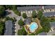Aerial view of community pool, clubhouse, and well maintained landscaping at 3733 Chattahoochee Summit Se Dr # 7, Atlanta, GA 30339