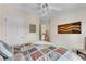 Inviting bedroom featuring neutral tones, a patterned bedspread, and an open doorway at 3733 Chattahoochee Summit Se Dr # 7, Atlanta, GA 30339