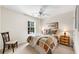 Cozy bedroom featuring a comfortable bed, side table, and a sunny window for natural light at 3733 Chattahoochee Summit Se Dr # 7, Atlanta, GA 30339