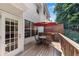 Inviting deck featuring a dining set under an umbrella, ideal for outdoor living and enjoyment at 3733 Chattahoochee Summit Se Dr # 7, Atlanta, GA 30339
